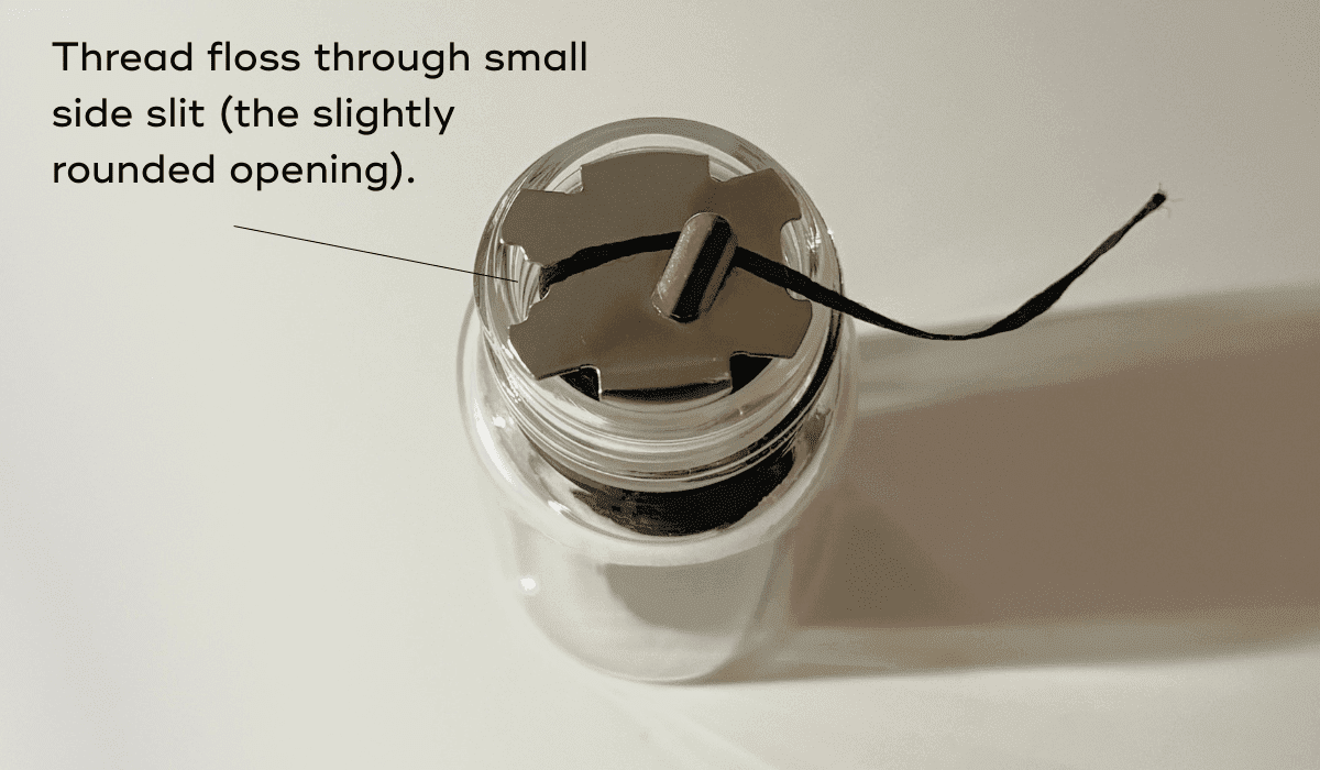 How do I refill my Glass Refillable Floss Container?