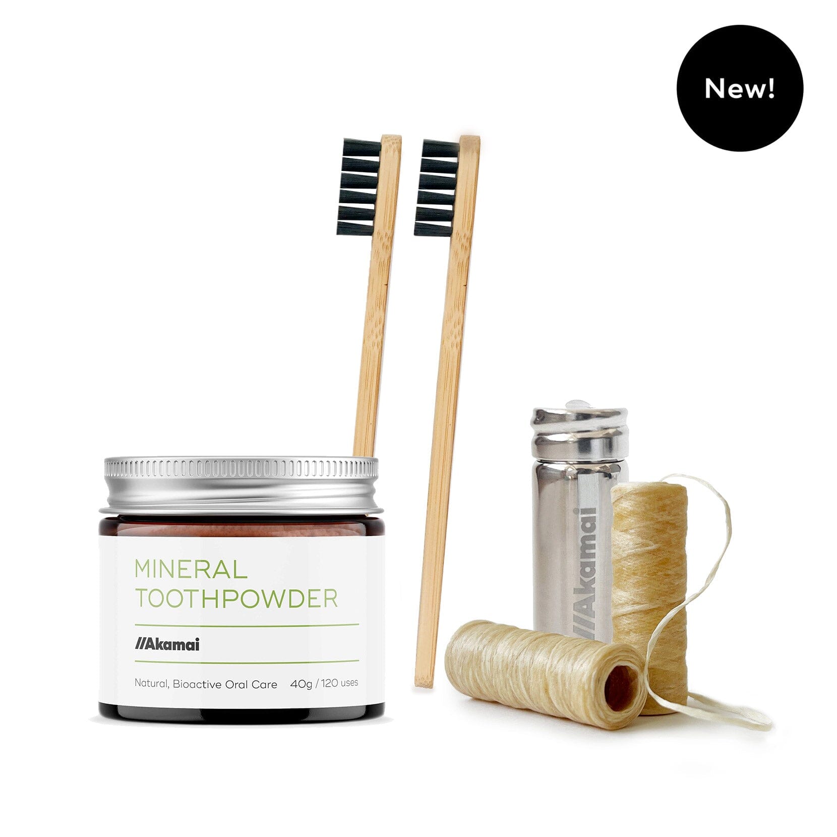 ORAL CARE ESSENTIALS KIT featuring Akamai Basics Mineral Toothpowder, bamboo toothbrushes, and biodegradable dental floss.
