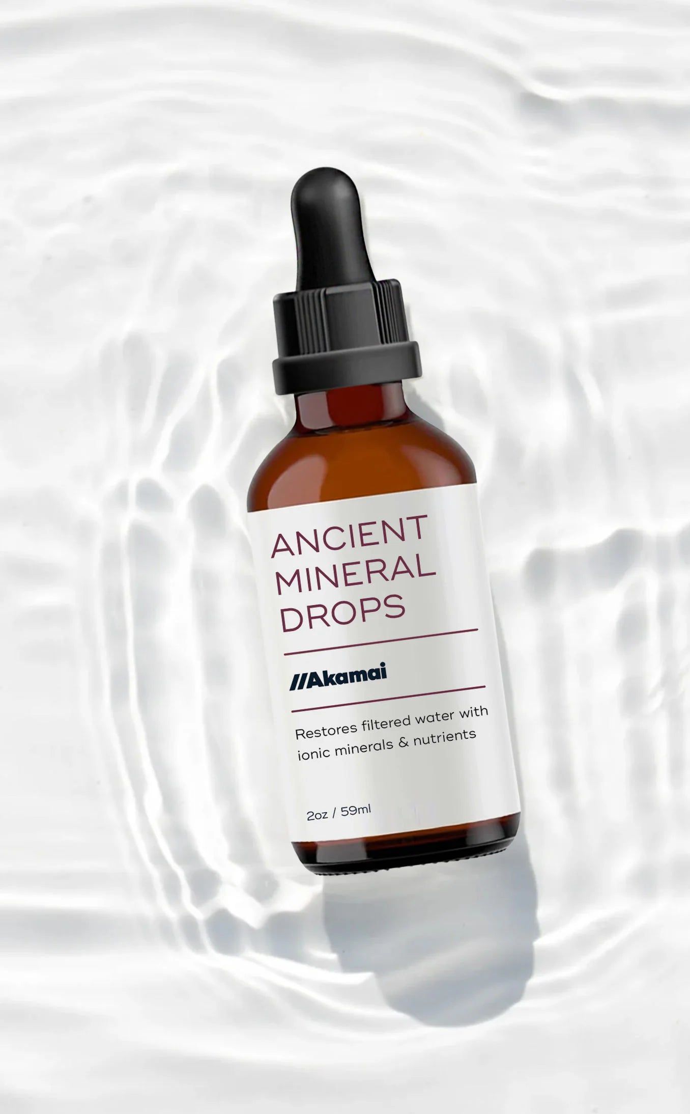 Akamai Basics Ancient Mineral Drops in a glass dropper bottle, featuring ionic minerals for healthy hydration.