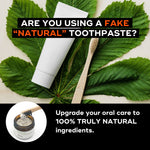 A tube of natural toothpaste beside a bamboo toothbrush and a jar of natural ingredients, highlighting holistic oral care.