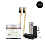 ORAL CARE ESSENTIALS KIT featuring Akamai Basics mineral toothpowder, bamboo toothbrushes, and dental floss for holistic oral care.
