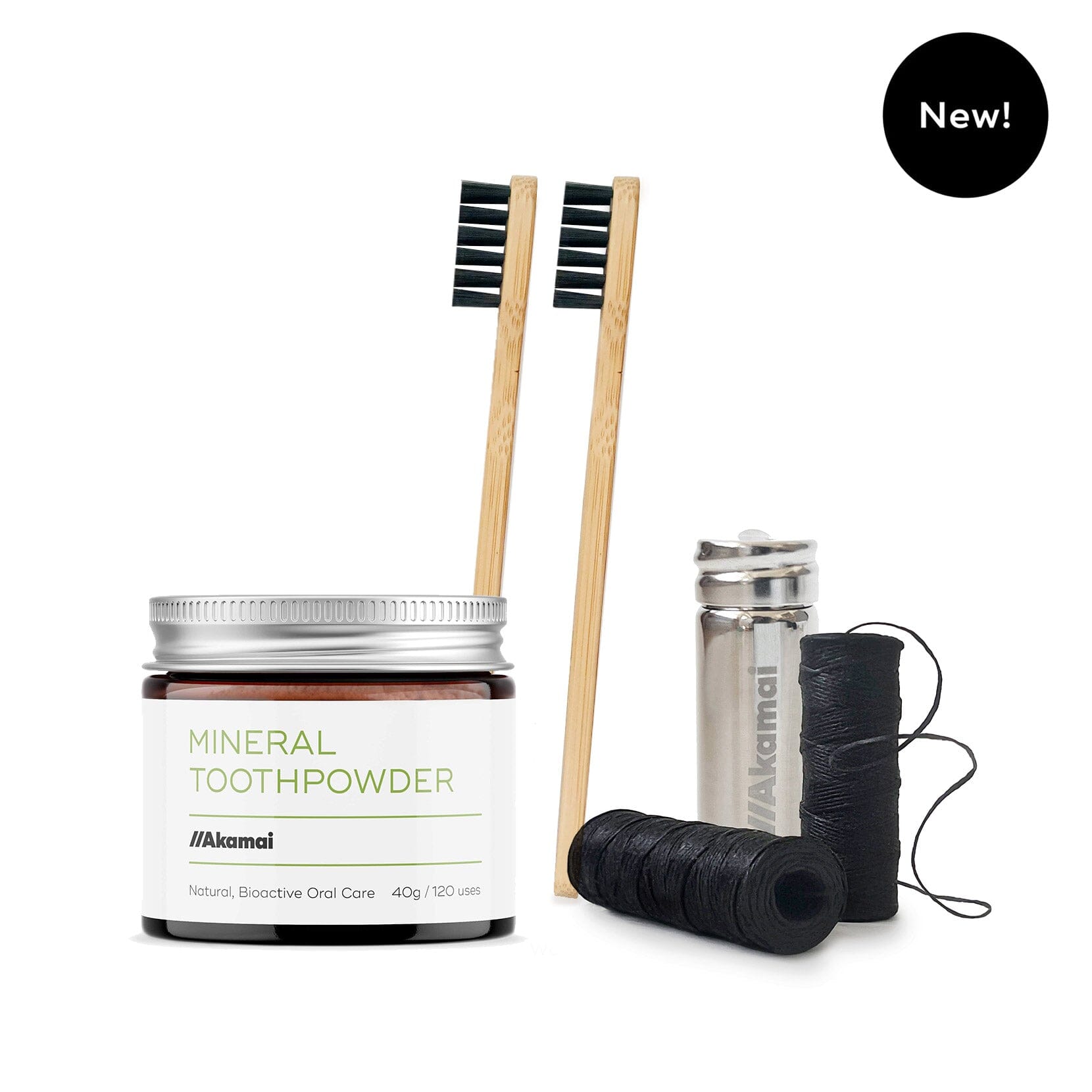 ORAL CARE ESSENTIALS KIT featuring Akamai Basics mineral toothpowder, bamboo toothbrushes, and dental floss for holistic oral care.