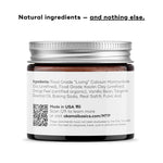 KIDS MINERAL TOOTHPOWDER jar showing natural ingredients like clay and orange peel, highlighting eco-conscious oral care.